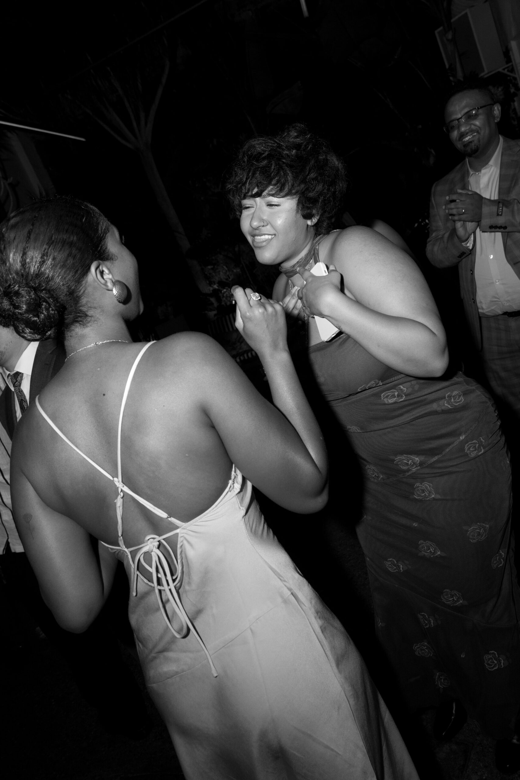 black and white direct flash photo of guests dancing during reception at Grass Room DTLA