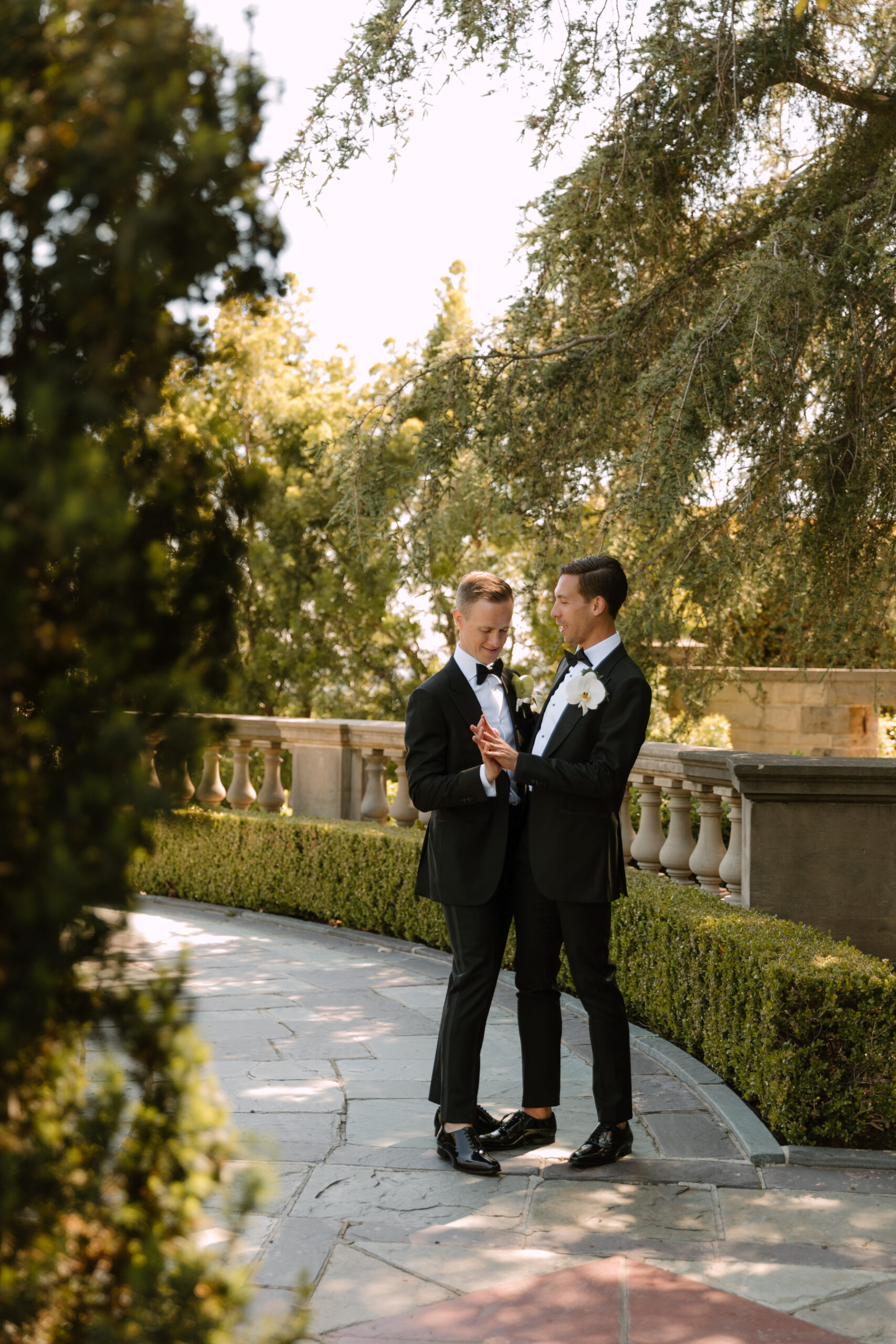 gay couple dancing in fountain garden at Greystone Mansion