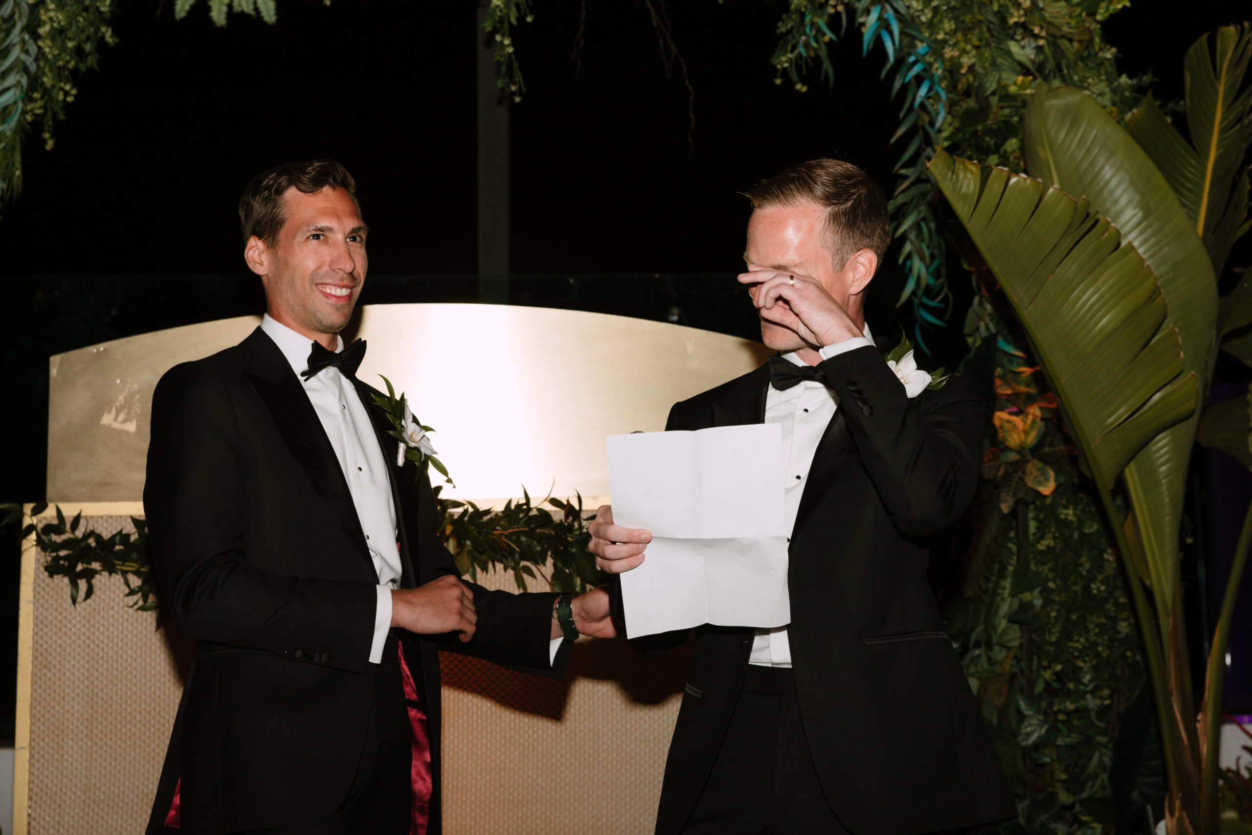 direct flash photo on Kimpton La Peer rooftop of groom crying while reading his wedding vows
