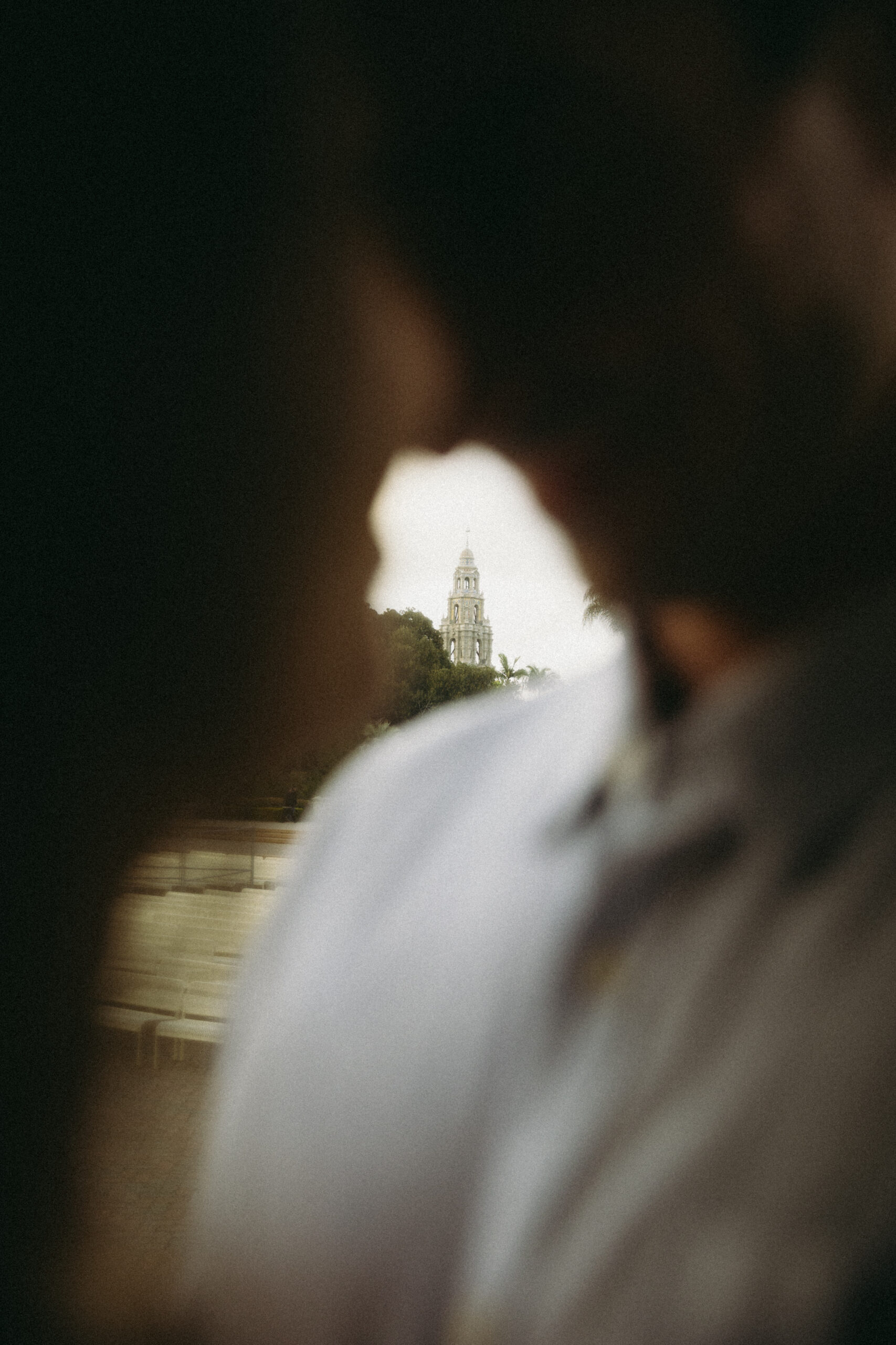 out of focus silhouette of couple at Balboa Park featuring California Tower