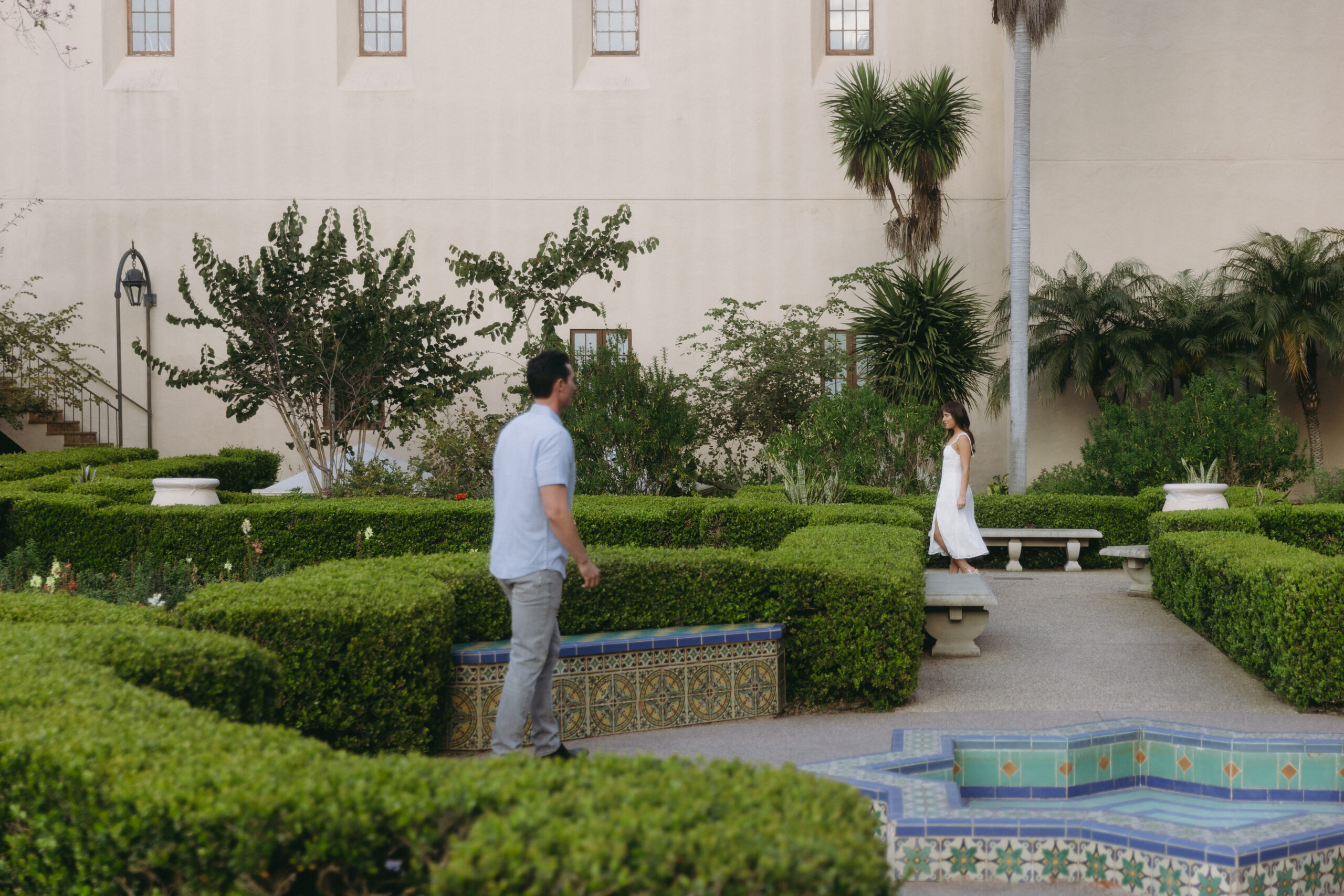 couple explores Alcazar Garden together at Balboa Park