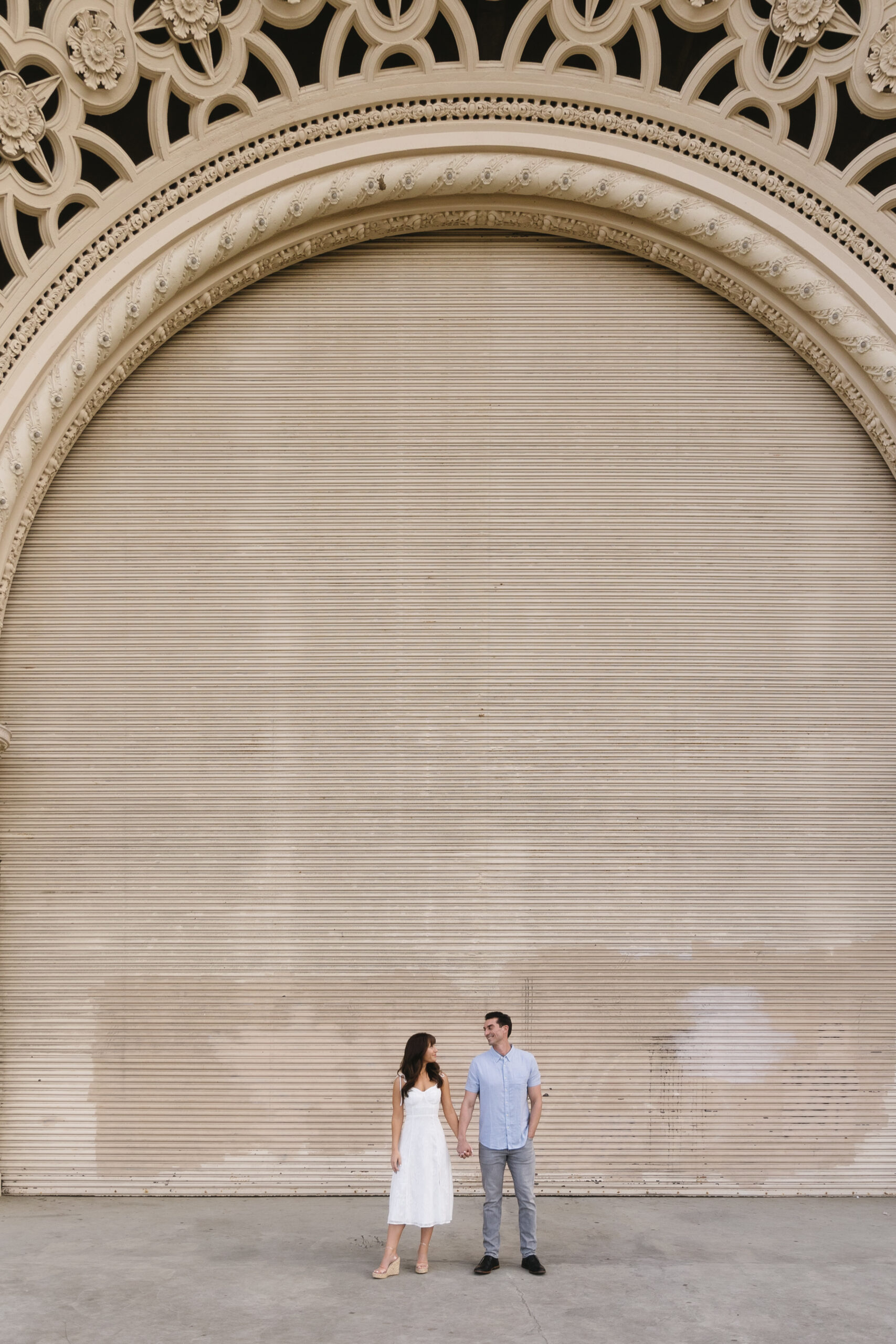 couple smiling at each other at Spreckels Organ Pavilion at Balboa Park