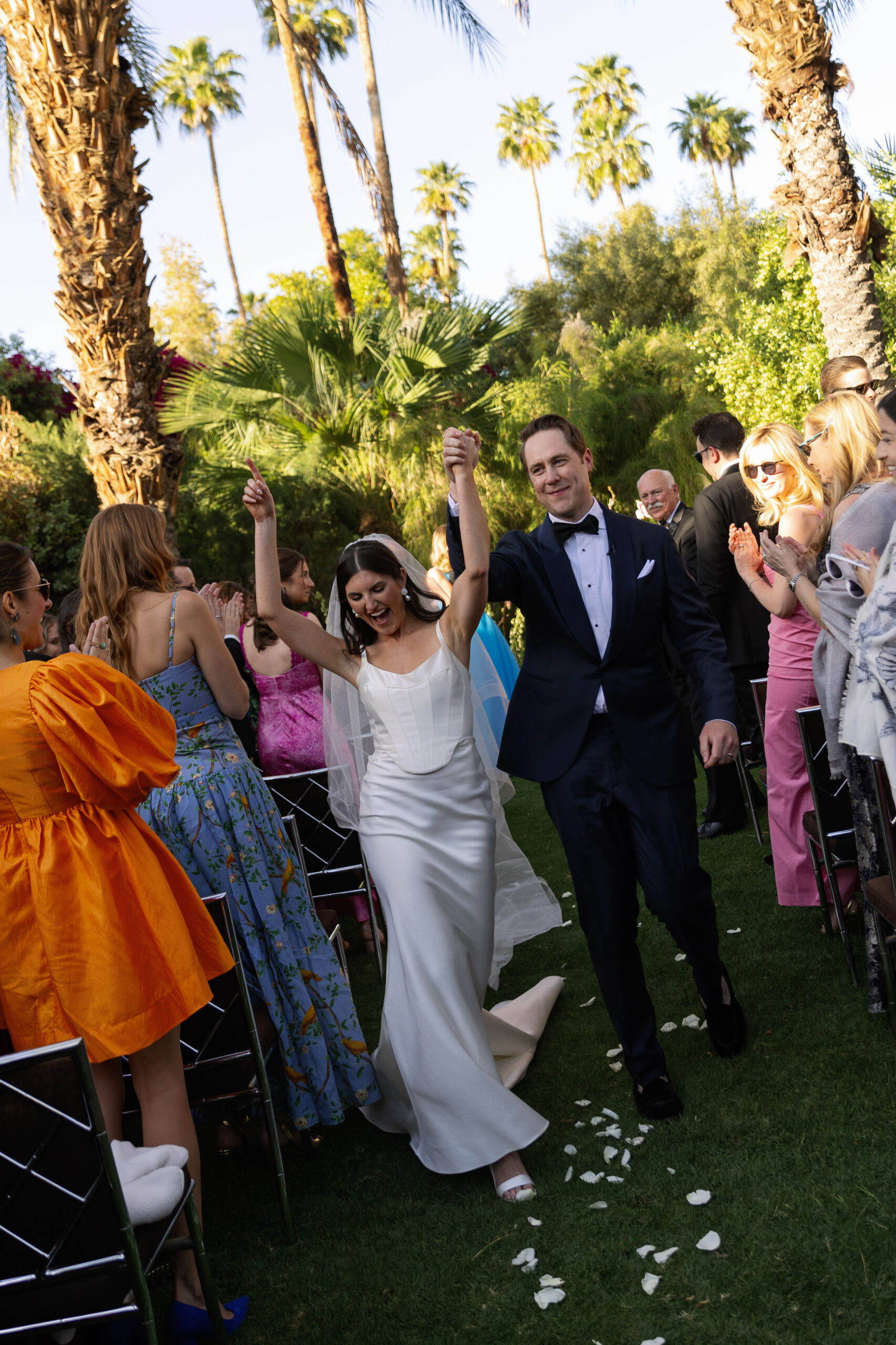 bride and groom walking back up aisle at Parker Palm Court