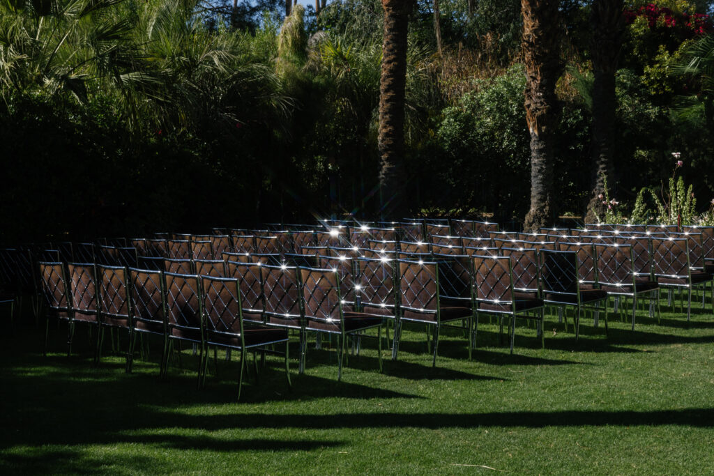 ceremony chair setup with reflective star flares on Palm Court at Parker Palm Springs