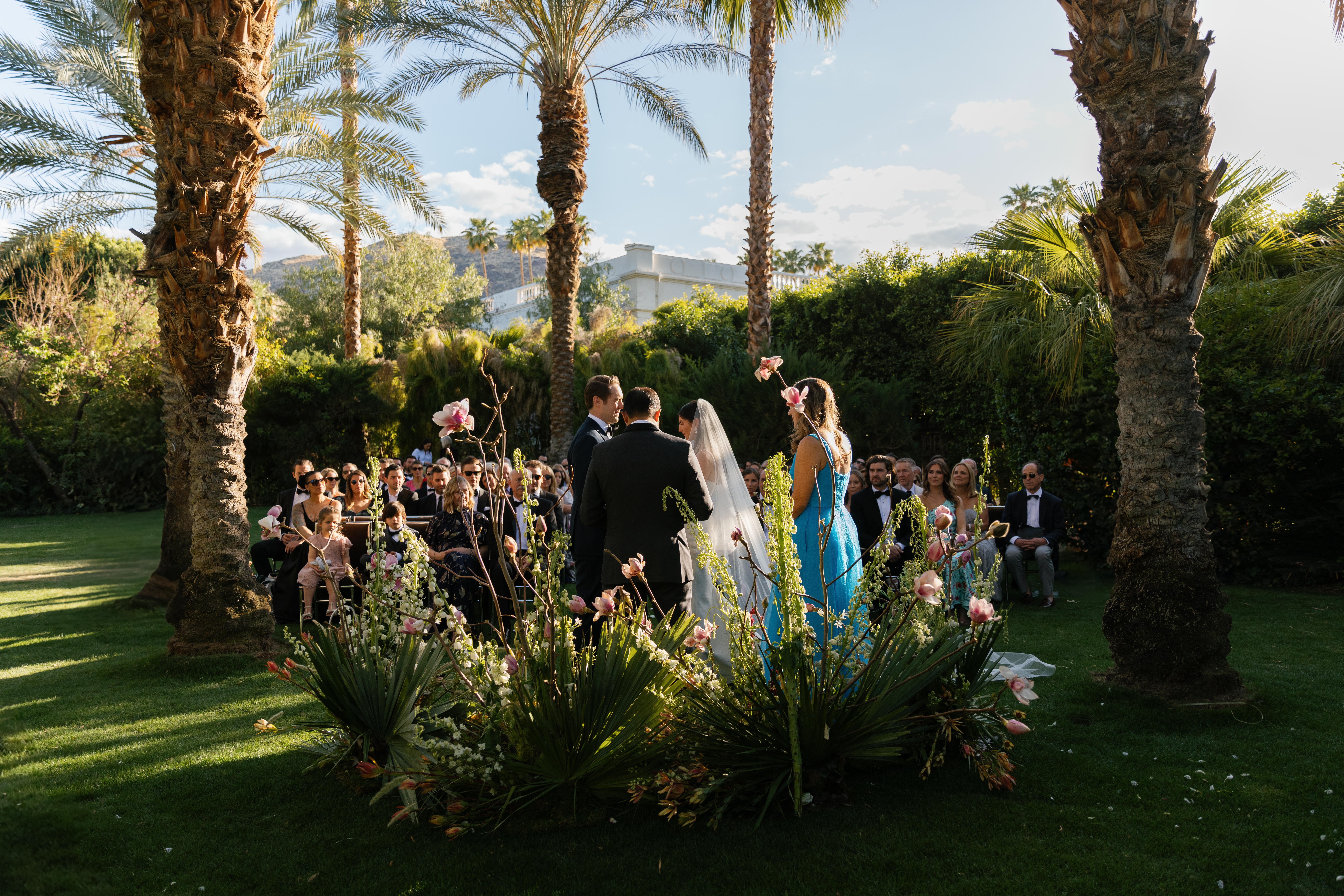 wide shot of ceremony from behind altar at Parker Palm court