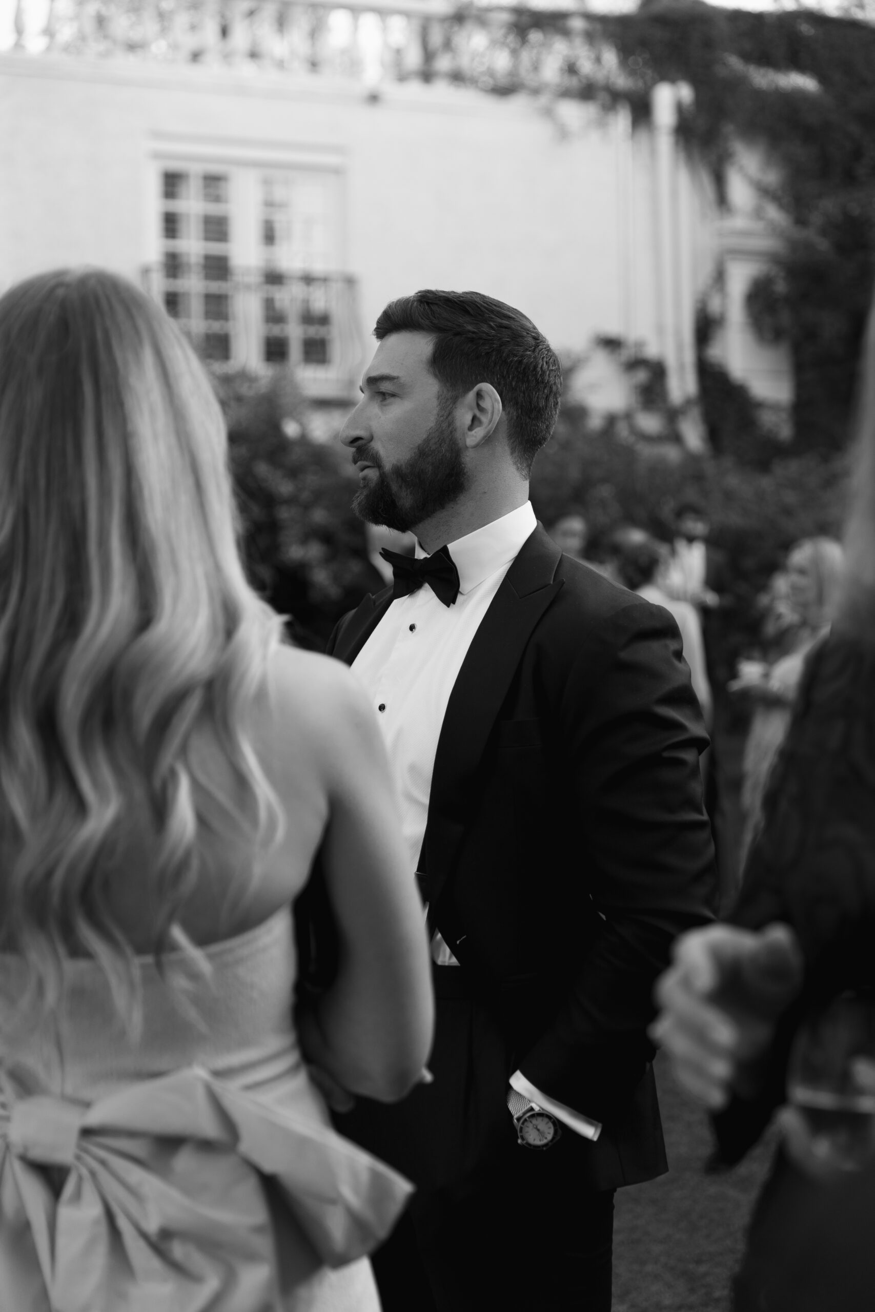 black and white image of guests at cocktail hour at Parker Palm Springs croquet lawn