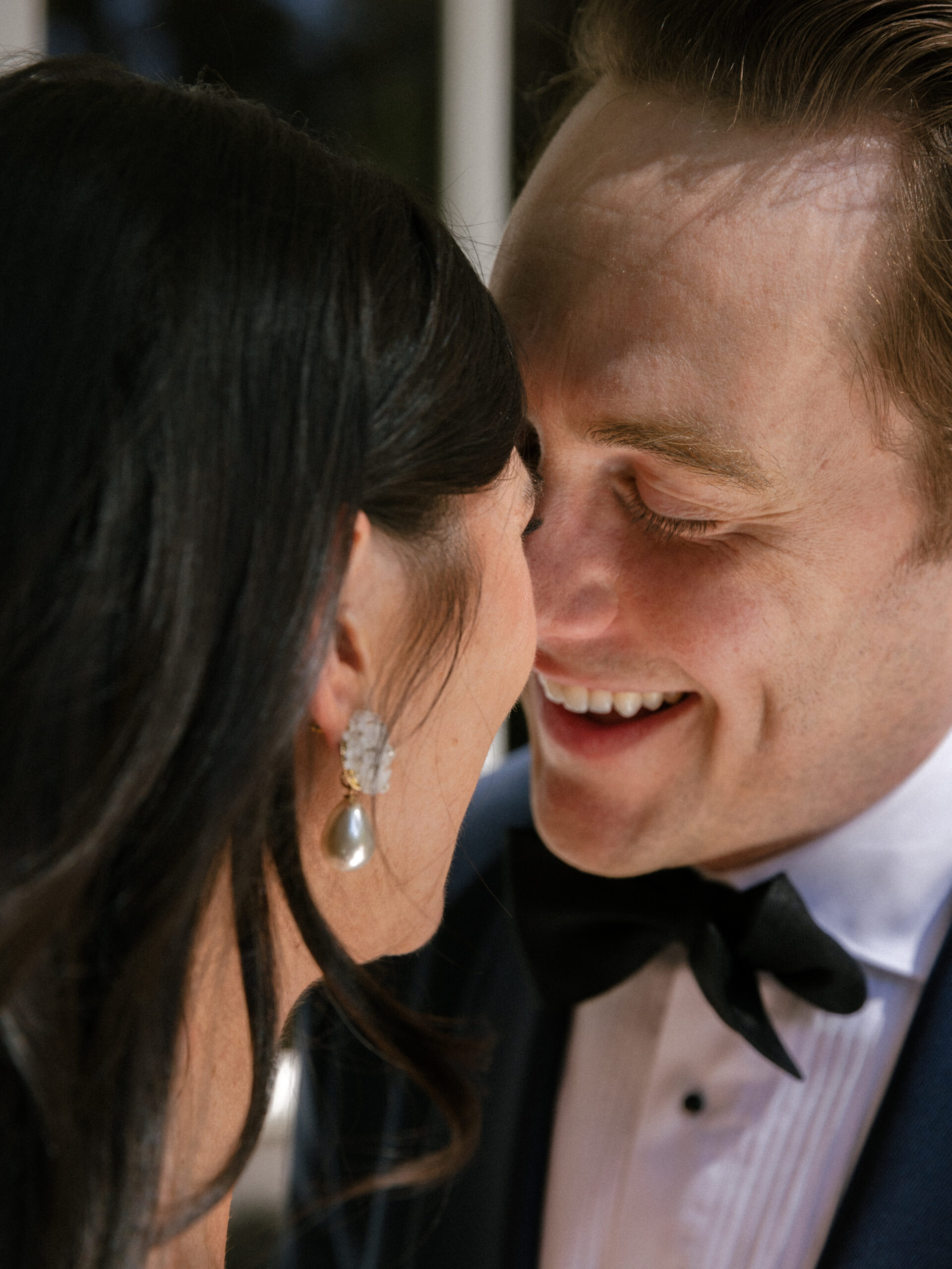 close up of bride and groom kissing after first look