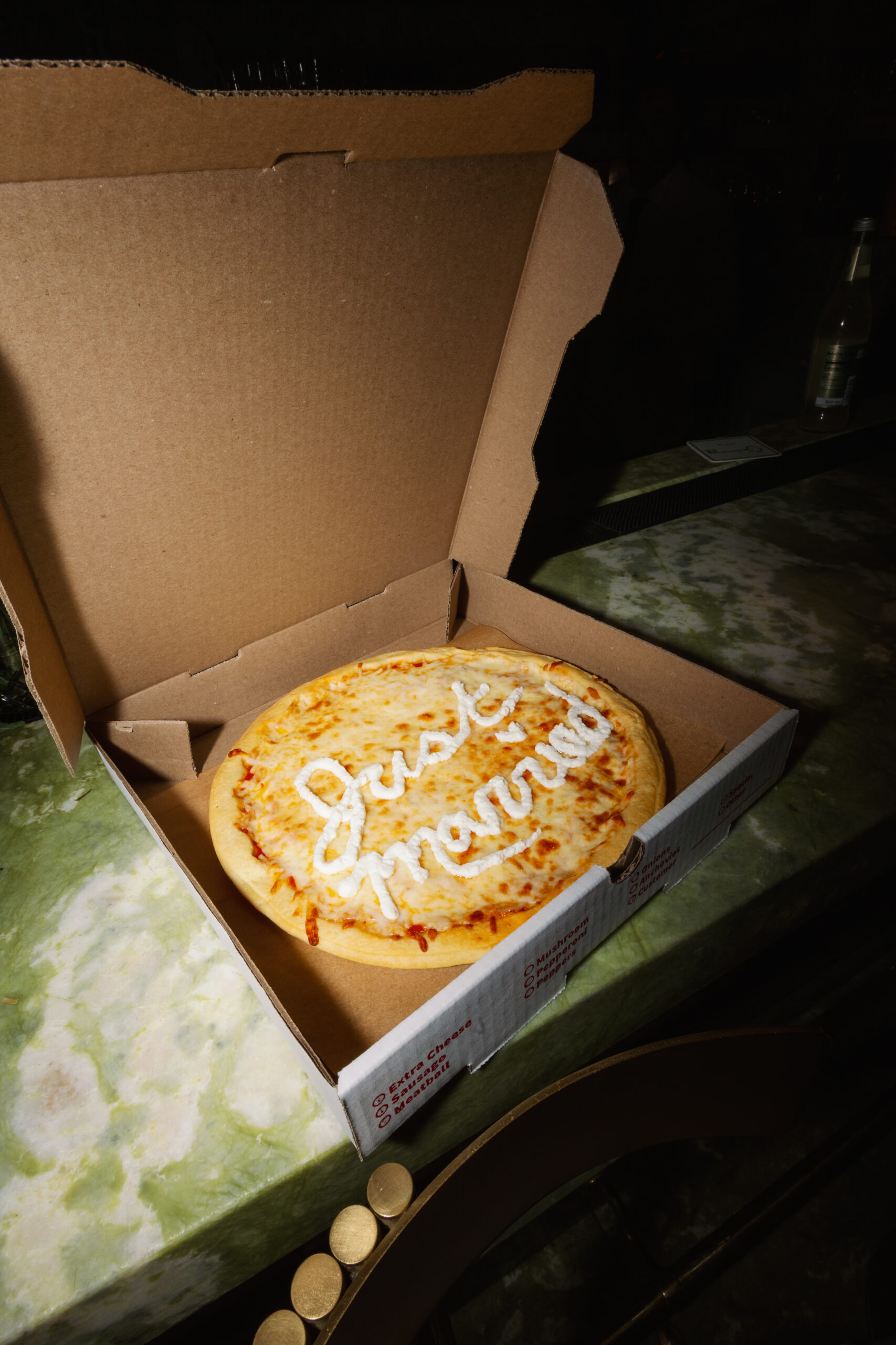 flash photo of just married custom pizza at Parker Palm Springs mini bar