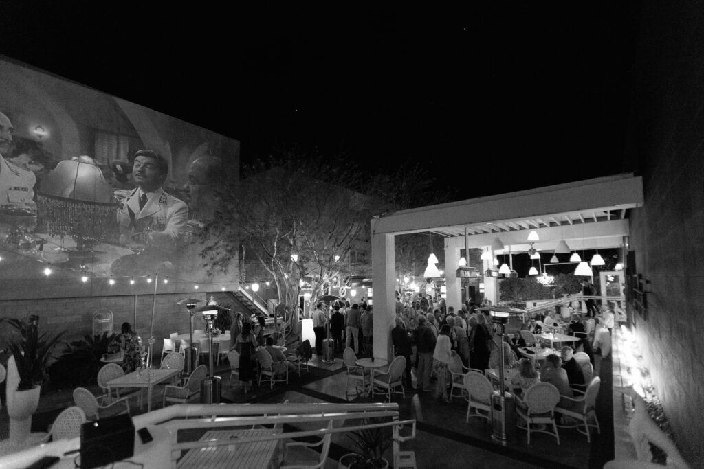 black and white photo of welcome reception drinks on patio at Eight4Nine in Palm Springs