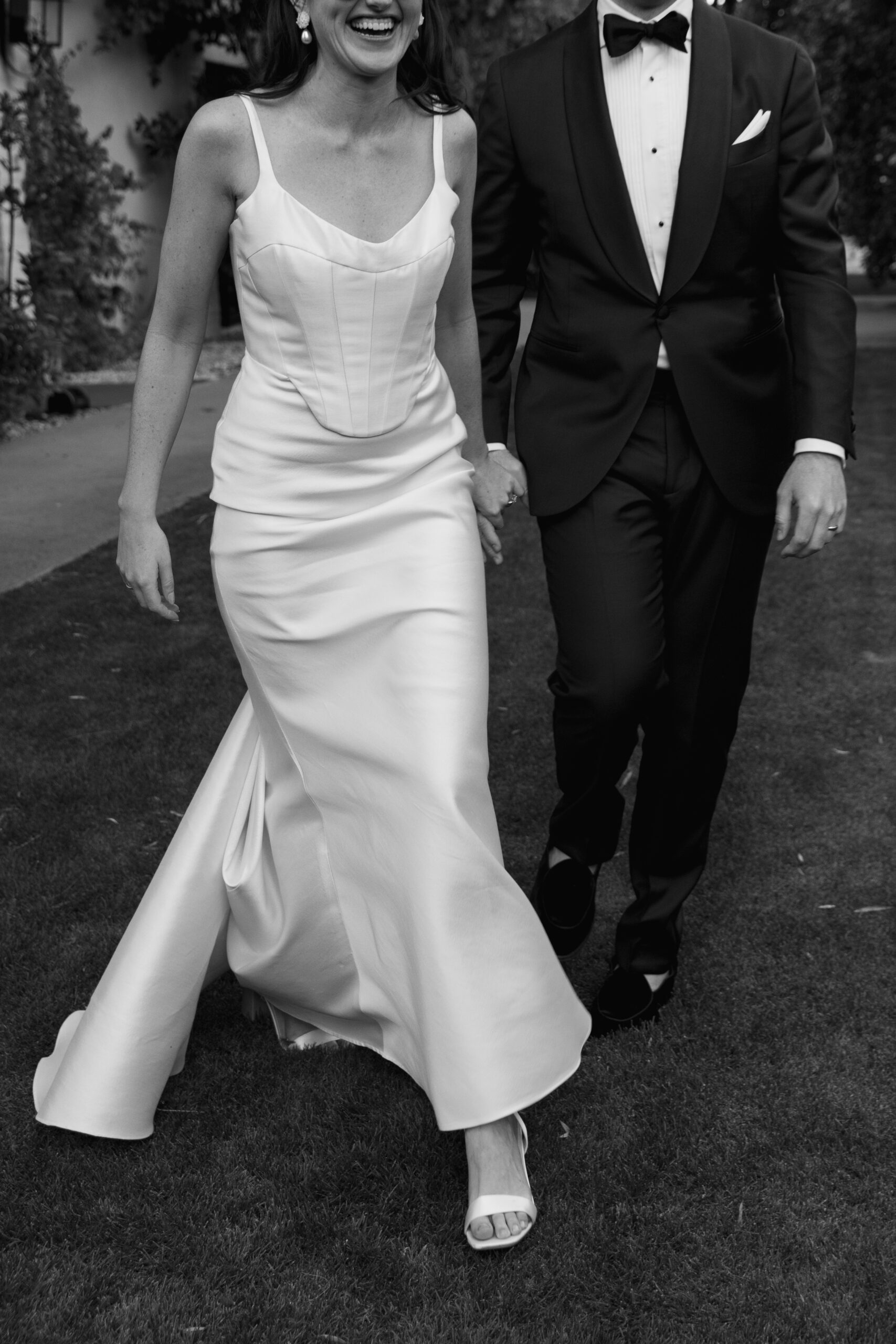 crop of bride and groom's attire as they walk back from first look at Parker Palm Springs